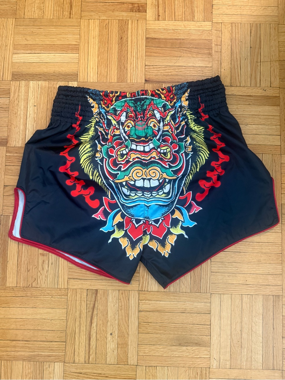 Fairtex Men's Black Muay Thai Shorts with Vibrant Multicolor Mask Graphic